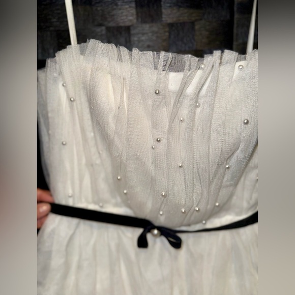 Floor-sweeping tulle, faux pearls, & a velvet belt pull this gorgeous look - Picture 3 of 6